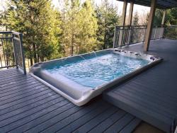 Coast Spas 14VE Swim Spa installed against decking